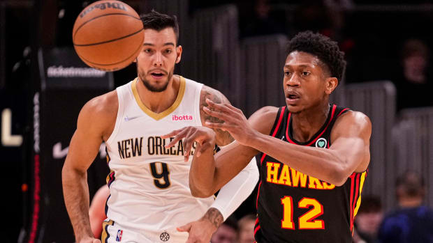 De'Andre Hunter passes the ball up the court.
